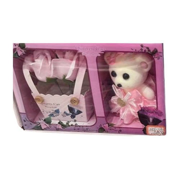 Soft teddy bear in gift box