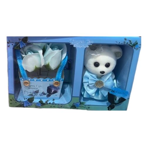 Soft teddy bear in gift box